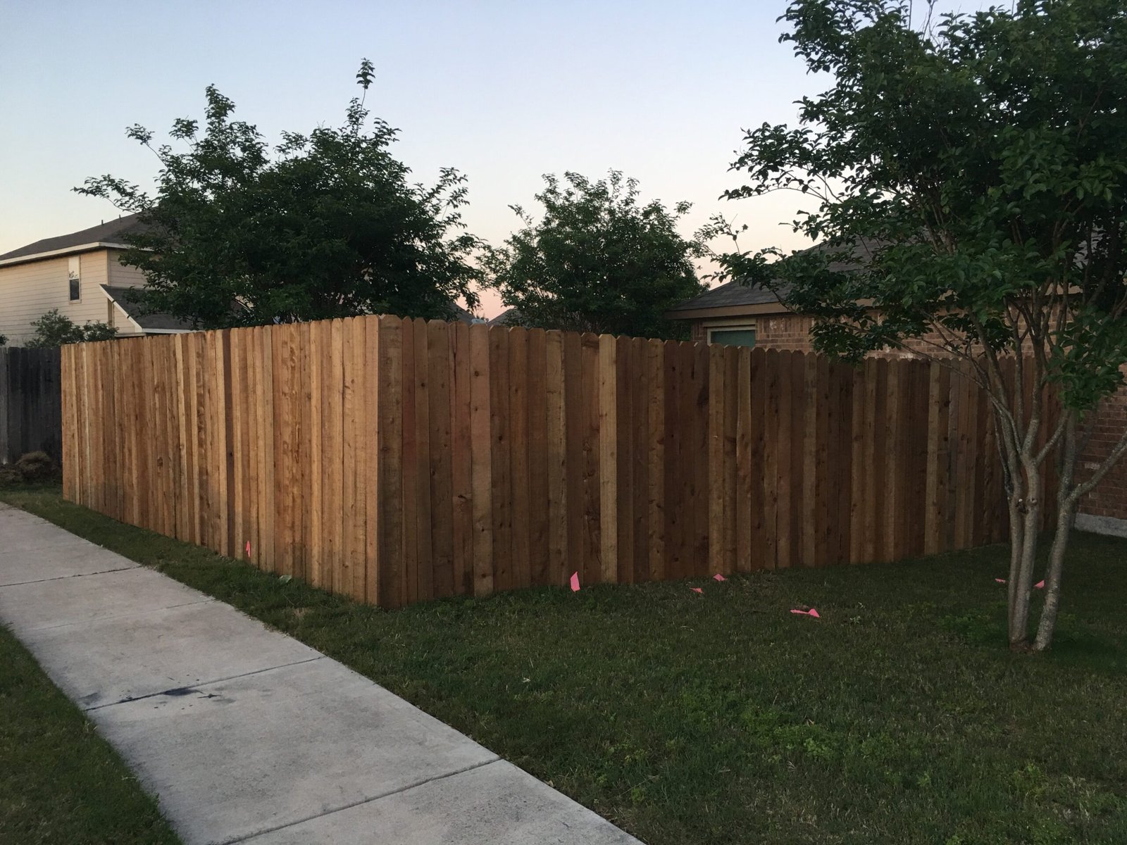 Completed wood fence project by Muñoz Texas Fences